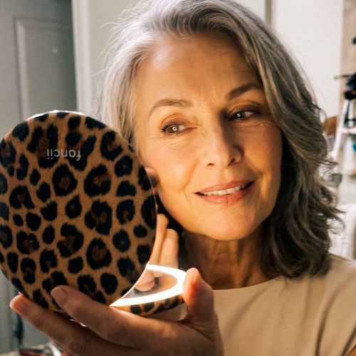 Taylor Lighted Compact in Cheetah Chic lighting up face