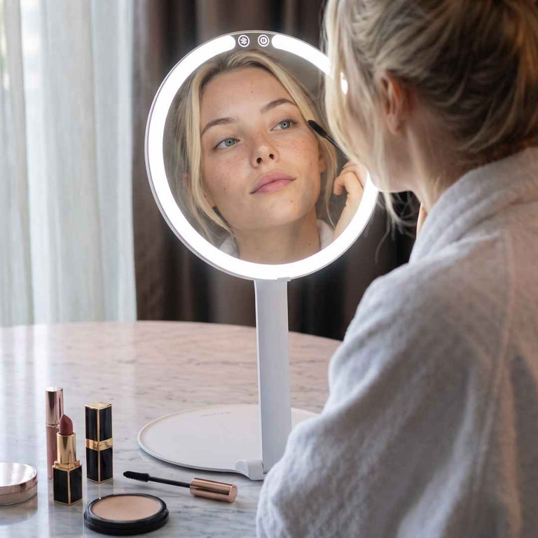 Abigail Foldable Lighted Travel Vanity by Fancii & Co. Lit Up and Being Used to Do Makeup