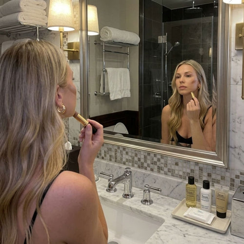 Model doing makeup in poor bathroom lighting