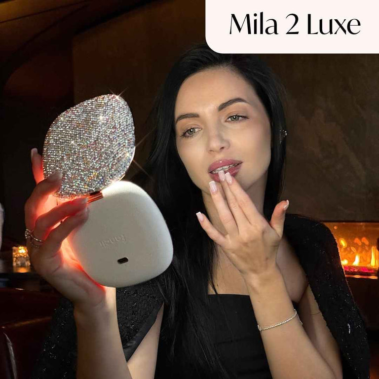 Model applies mascara using Vera with the Lara 10x Magnifier