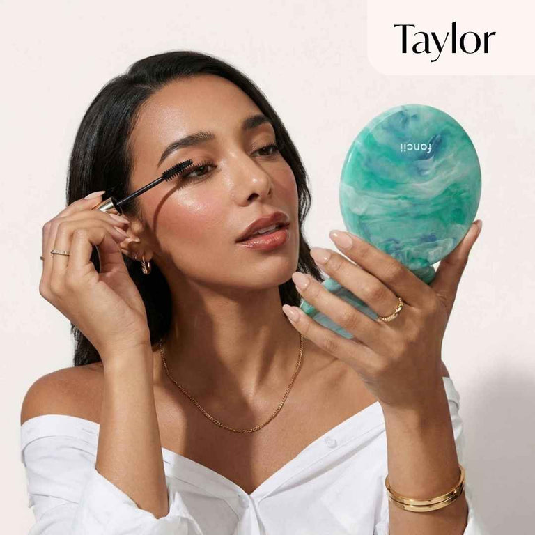 Model applies mascara using Taylor in Sea Serenity
