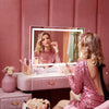 Woman using the Monroe hollywood mirror with lights by Fancii to apply lipstick lipgloss